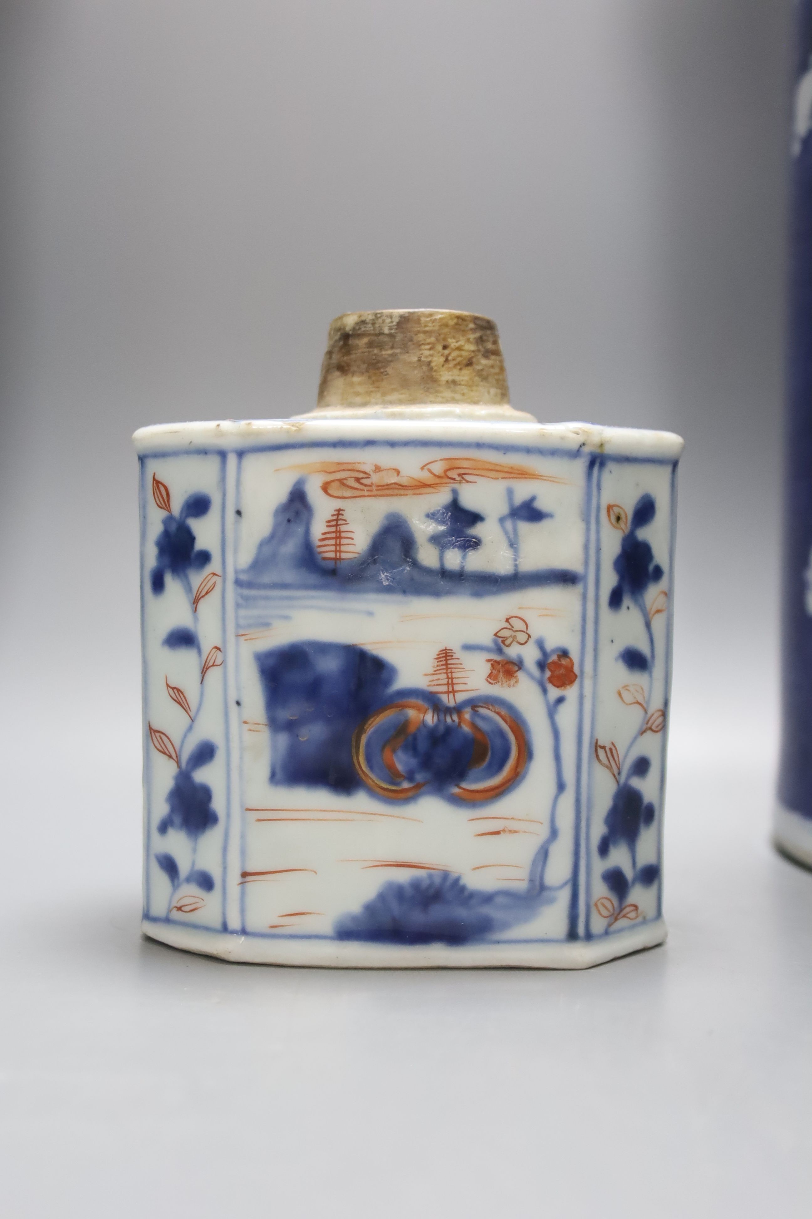 An 18th century Chinese famille rose mug, a Chinese Imari tea caddy and two Chinese blue and white sleeve vases 30cm (4)